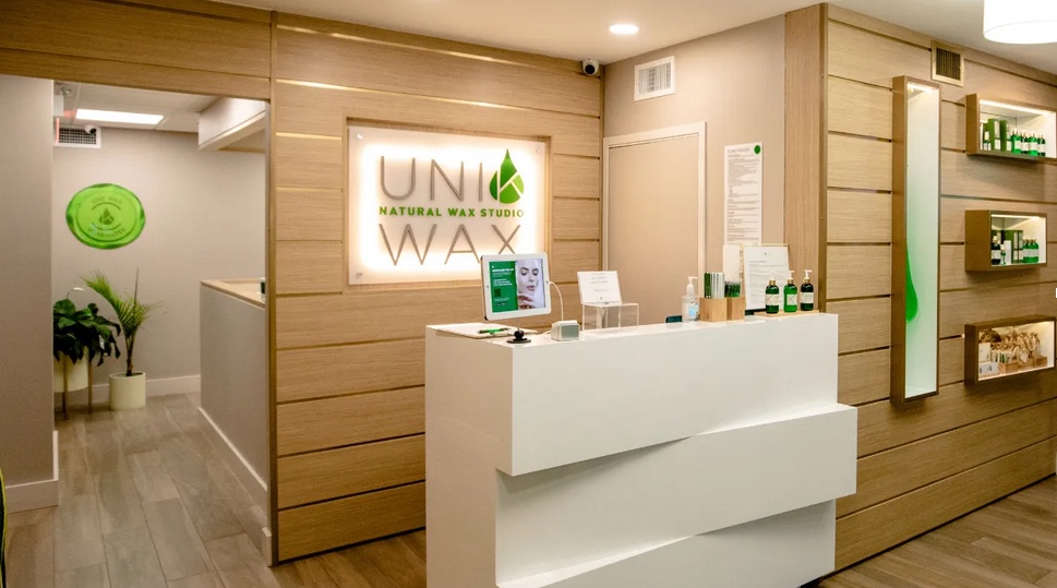 Uni K franchise inside store with a counter and light up sign with the logo
